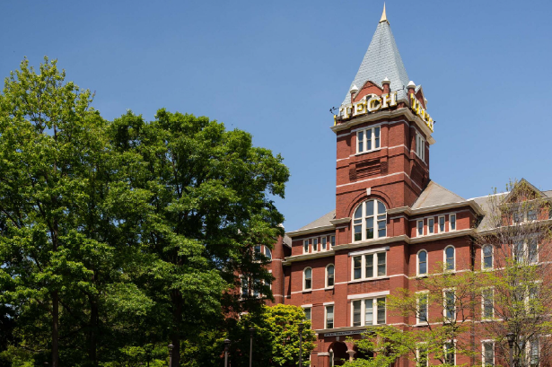 Tech Tower on the right with green trees on the left